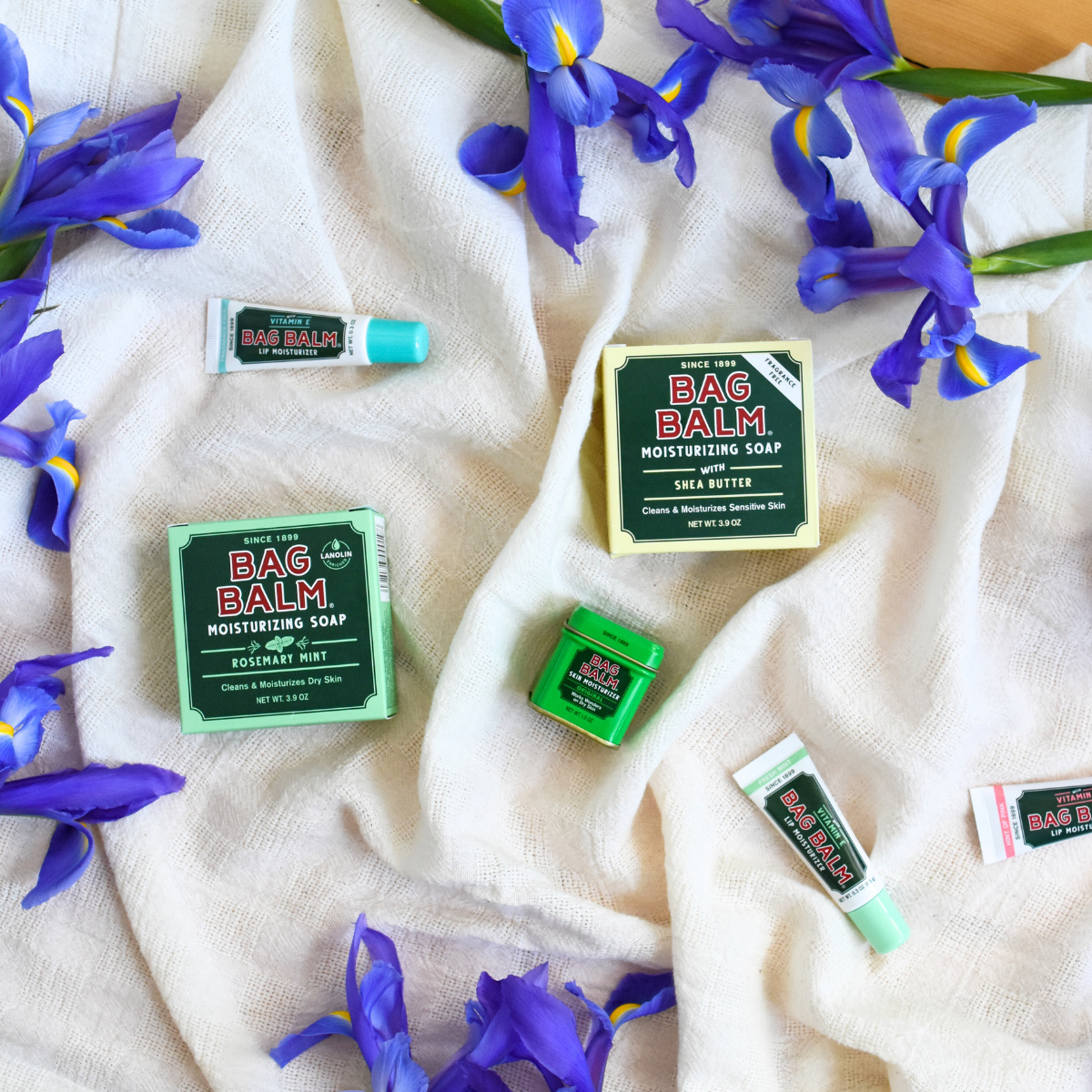 Lip Balm, Soap and Bag Balm on fabric with Iris Flowers