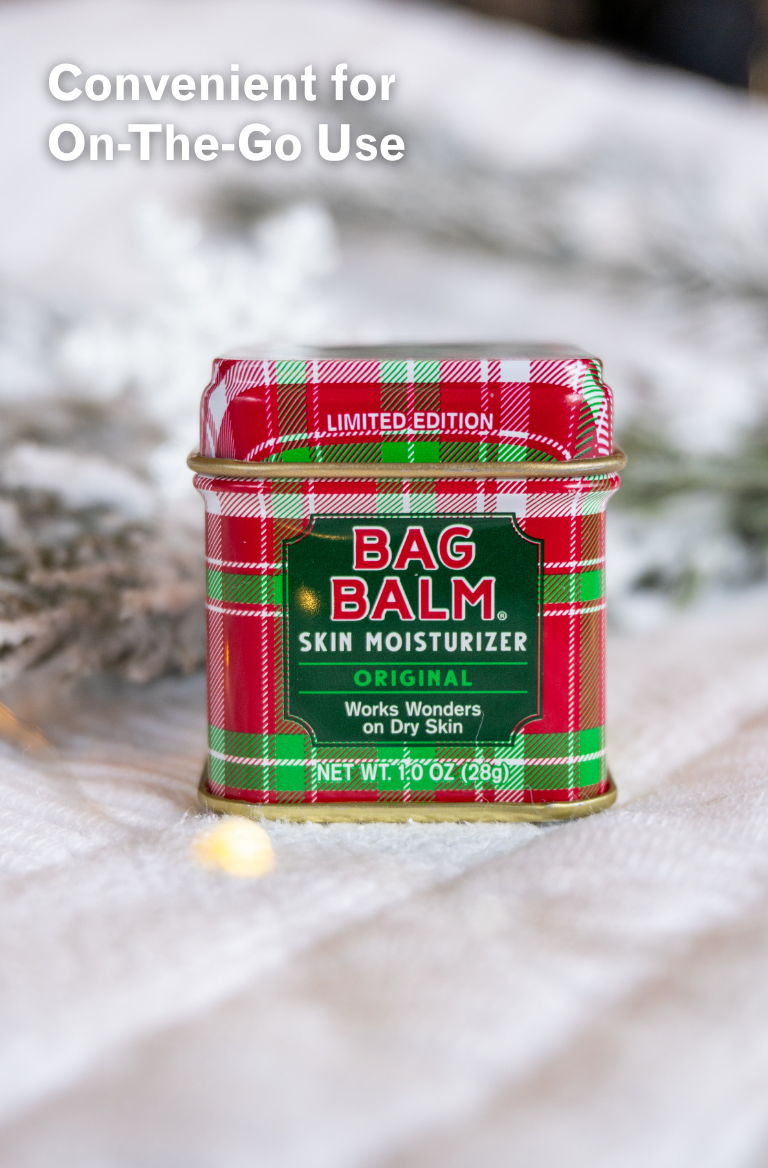 Red and green plaid tin of Bag Balm 1oz tin on white background