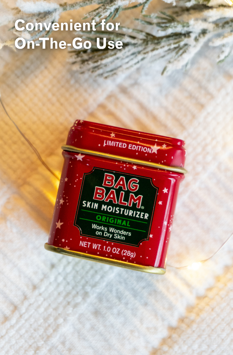 Red tin of Bag Balm skin moisturizer on a textured surface with text 'Convenient for On-The-Go Use'.