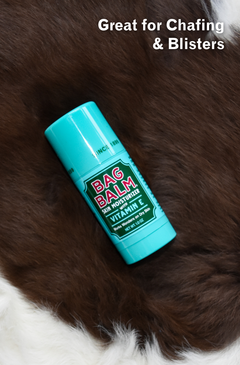 Bag Balm stick on a fur surface with text 'Great for Chafing & Blisters'.
