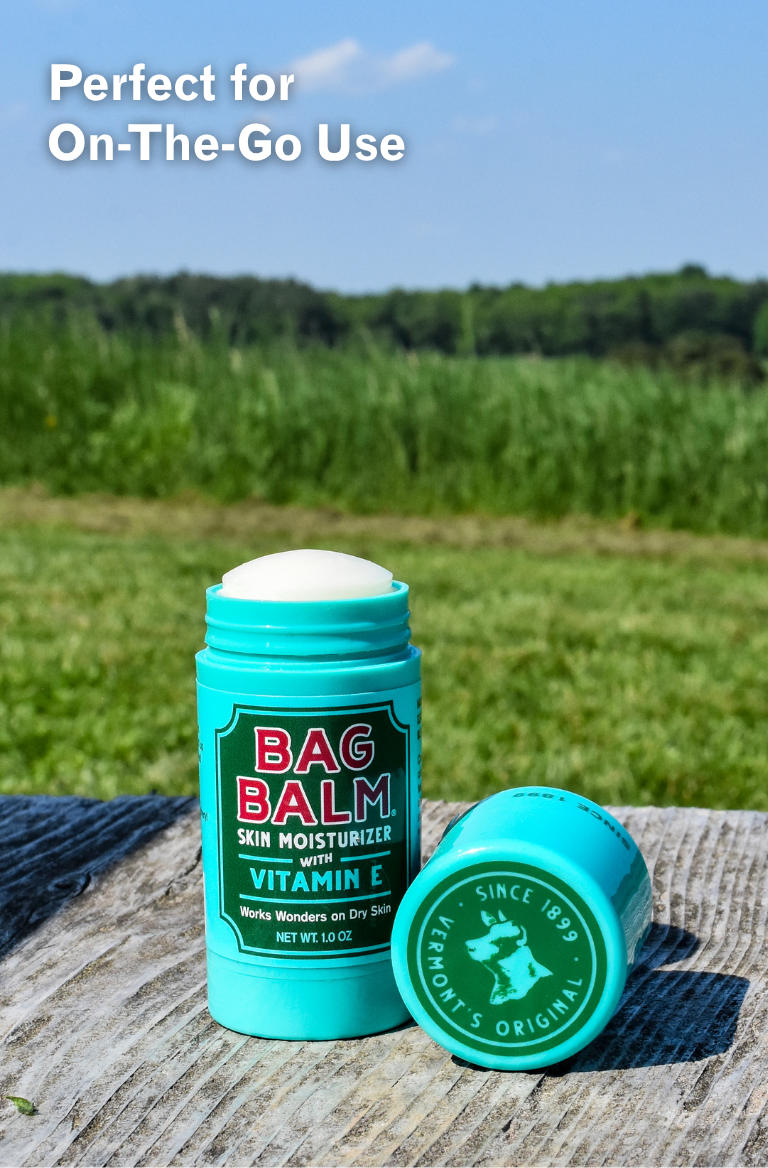 Bag Balm stick on a wooden surface with a natural background