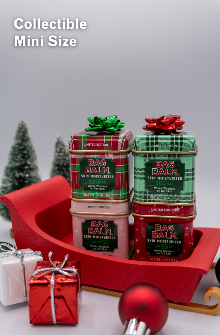Collectible mini size bag balm containers with Christmas-themed packaging on a decorative sleigh.