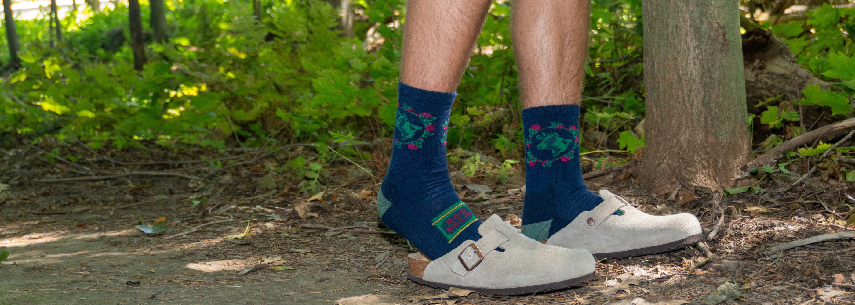 Person wearing Bag Balm socks with shoes in a forest setting