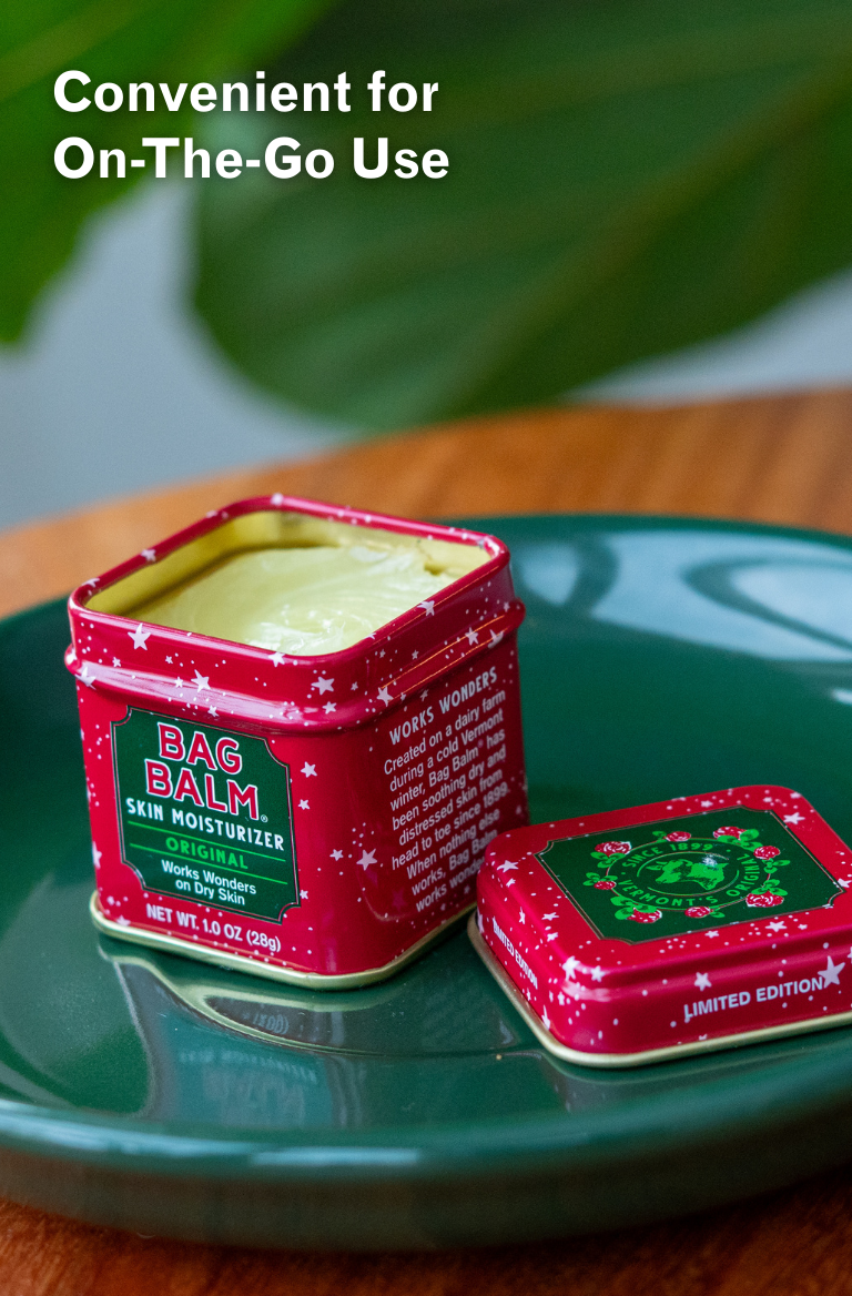 Red tin of Bag Balm skin moisturizer on a green surface with text 'Convenient for On-The-Go Use'.