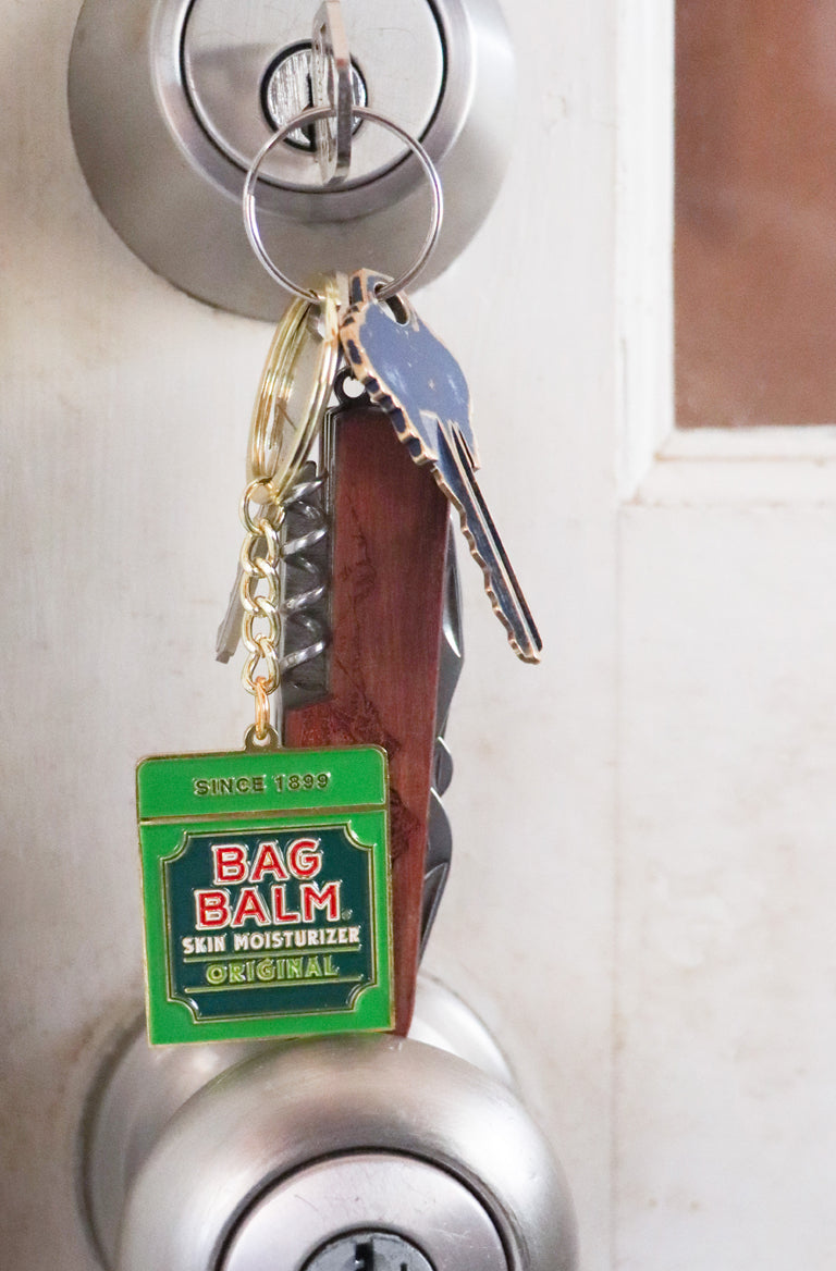 Keychain shaped like Bag Balm tin