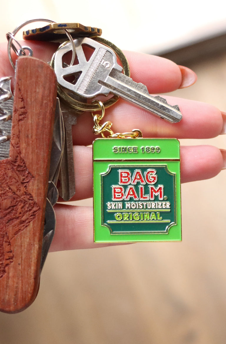 Keychain shaped like Bag Balm tin