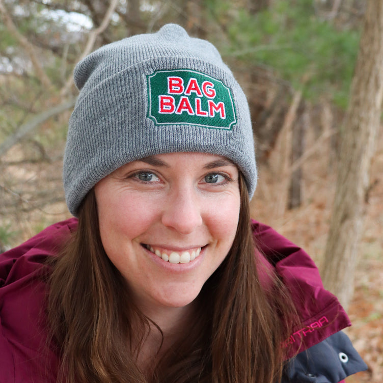 Woman wearing Bag Balm beanie