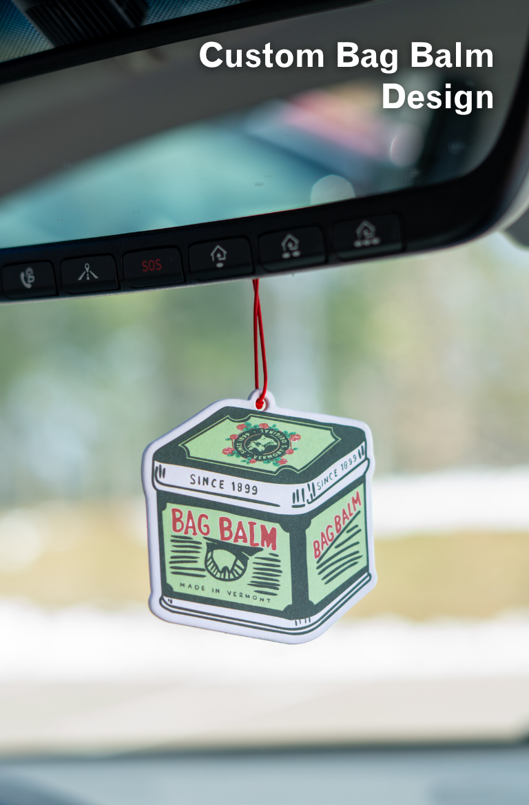 Bag Balm Air Freshener hanging from rear view mirror in car