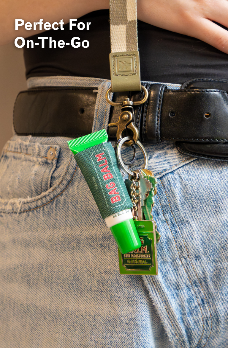 BAG BALM product attached to a belt with text 'Perfect For On-The-Go'.
