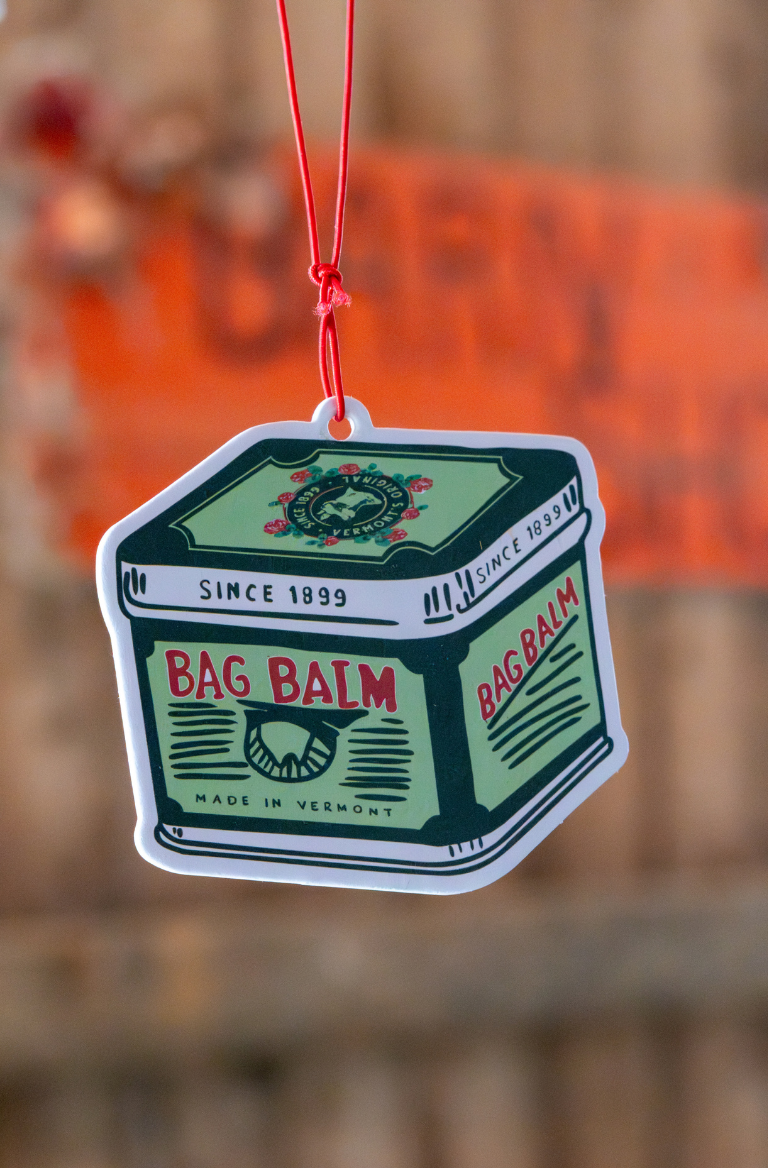 Bag Balm air freshener hanging in a barn
