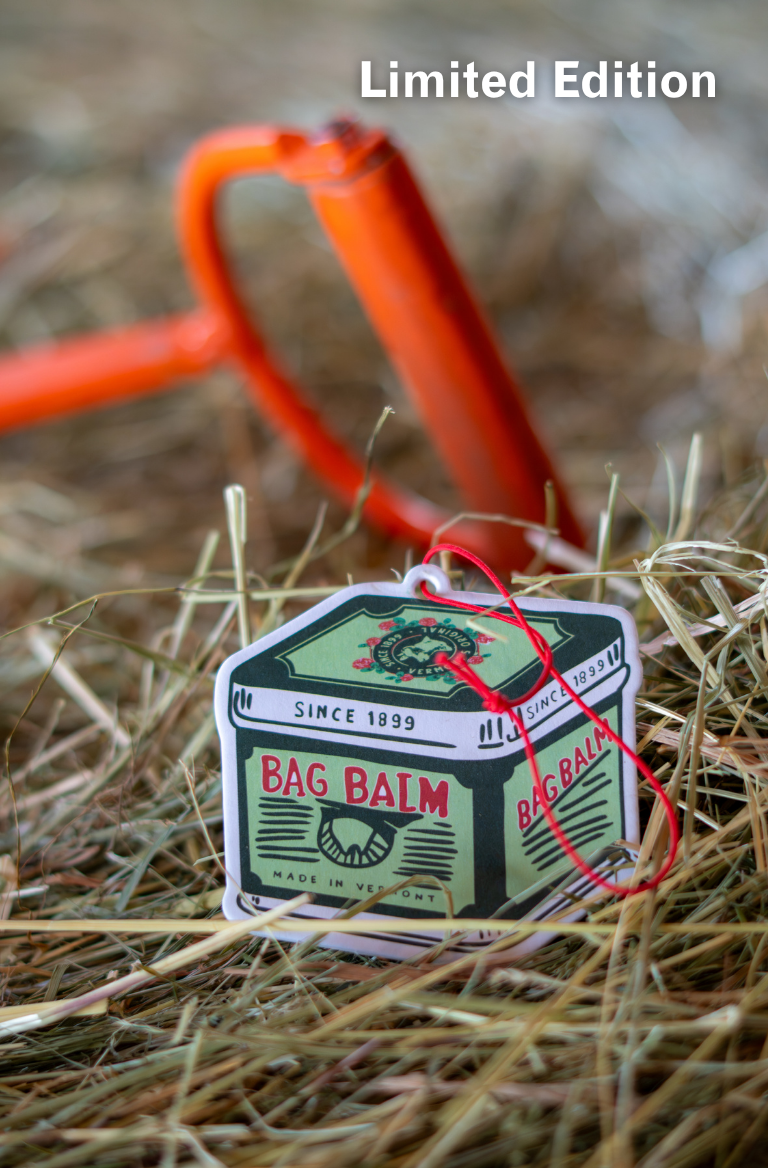 Bag Balm Air Freshener on a hay bale with orange shovel in background