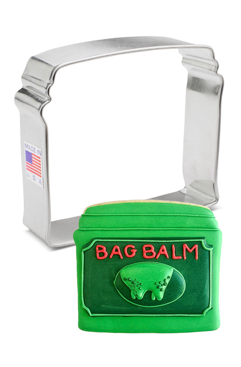 Cookie cutters shaped like Bag Balm tins and cow from bag balm logo, a fun addition to any kitchen.