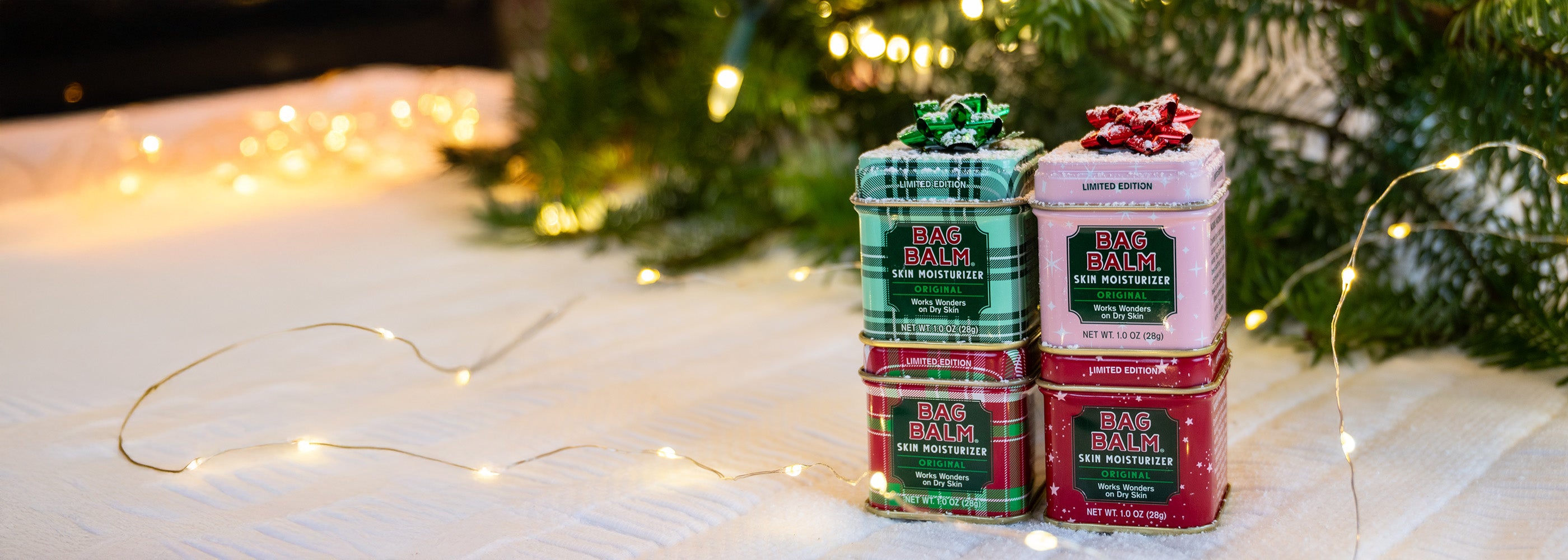 Four Limited Edition Holiday Bag Balm Mini Tins